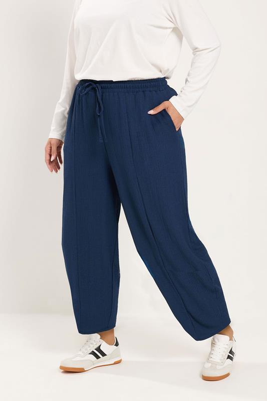 YOURS Plus Size Navy Blue Crinkle Barrel Trousers | Yours Clothing 1