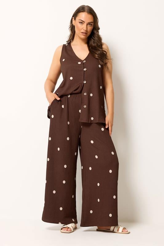 YOURS Plus Size Chocolate Brown Polka Dot Crinkle Trousers | Yours Clothing 1