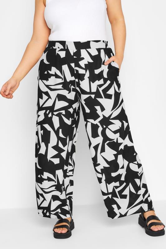 YOURS Plus Size Black Abstract Print Wide Leg Trousers | Yours Clothing 1
