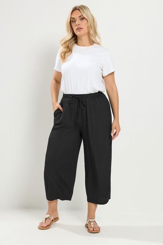 YOURS Plus Size Black Crinkle Barrel Trousers | Yours Clothing 1