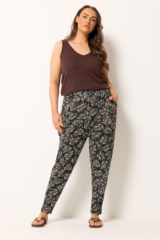 YOURS Plus Size Black Leaf Print Double Pleat Harem Trousers | Yours Clothing 1