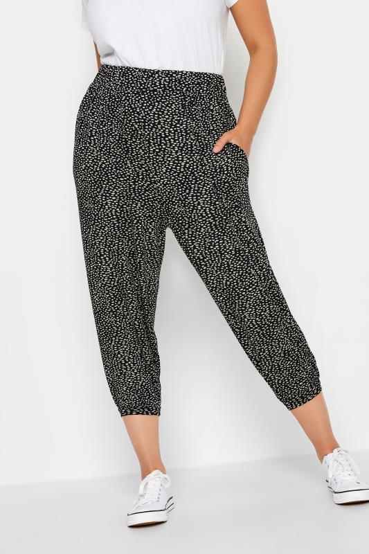YOURS Plus Size Black Spot Print Cropped Harem Joggers | Yours Clothing 1