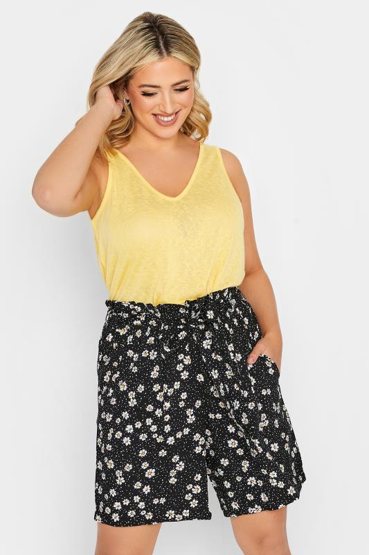 YOURS Plus Size Black Daisy Print Paperbag Waist Shorts | Yours Clothing 1
