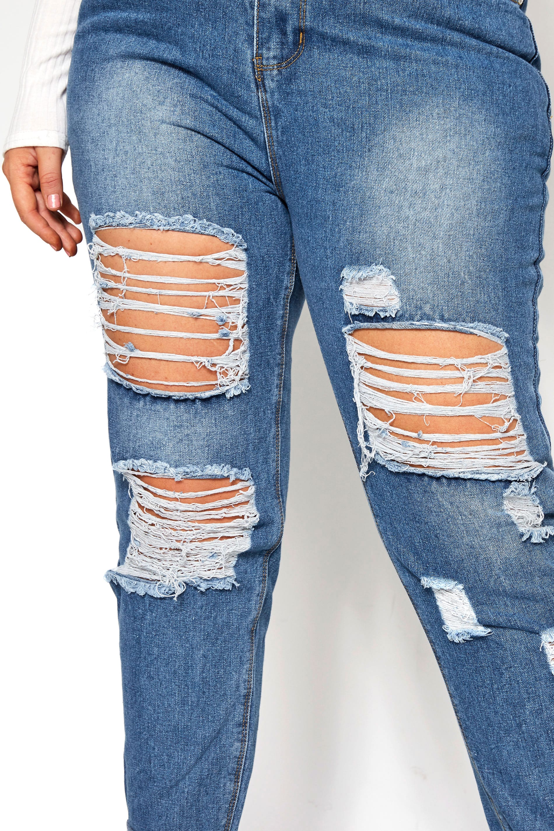 extreme ripped blue jeans