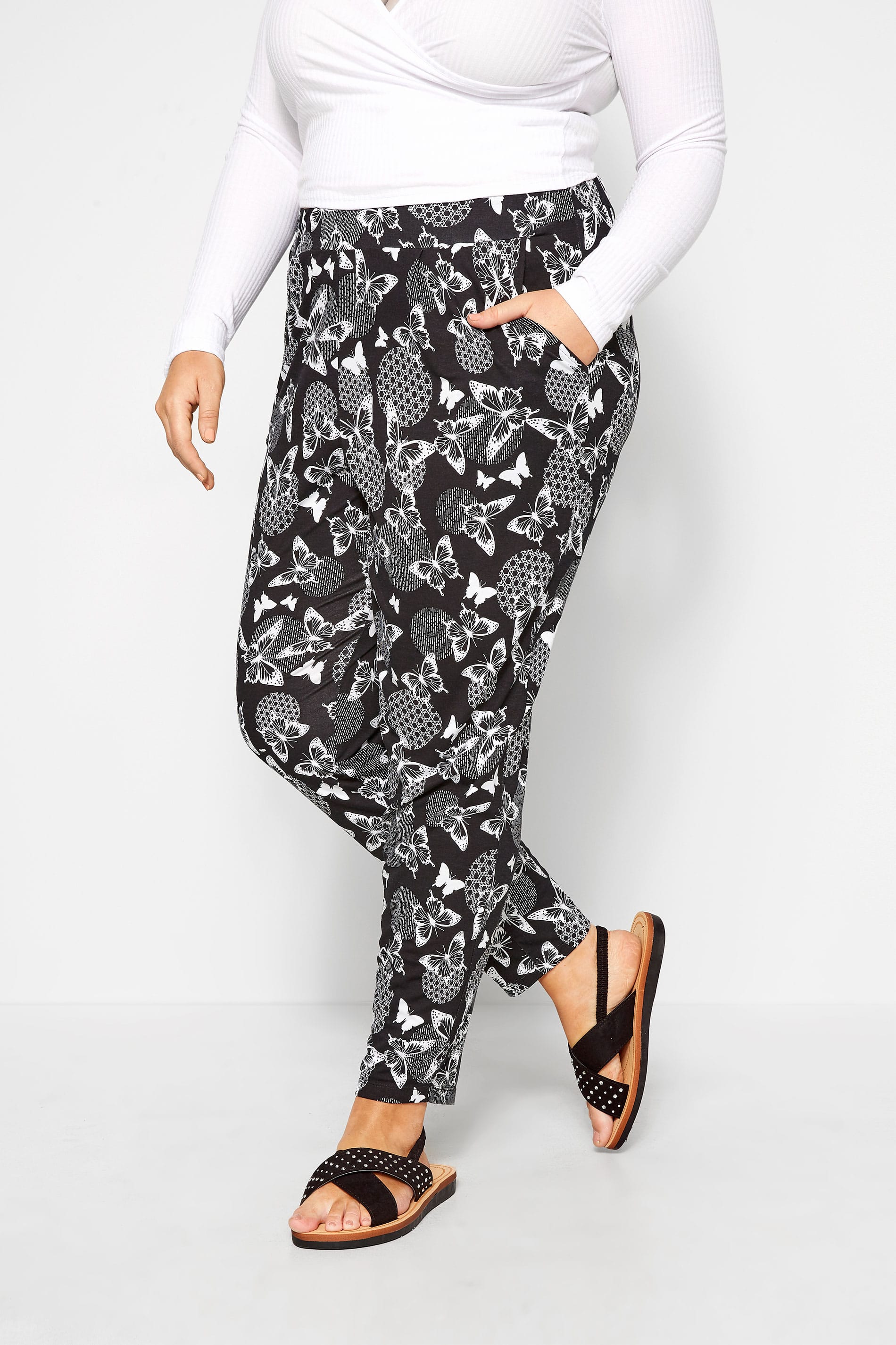 Black Butterfly Print Tapered Trousers | Yours Clothing
