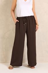 EVANS Plus Size Chocolate Brown Tie Waist Wide Leg Trousers | Evans 1