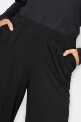 YOURS Curve Plus Size Black Pleated Wide Leg Stretch Trousers | Yours ...