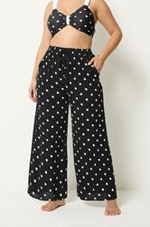 YOURS Plus Size Black Polka Dot Crinkle Beachwear Wide Leg Trousers | Yours Clothing 1