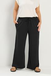 YOURS Plus Size Black Soft Touch Wide Leg Trousers | Yours Clothing 1