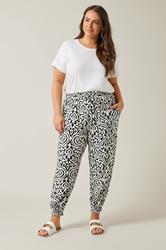 EVANS Plus Size Black Ikat Print Cuffed Harem Trousers | Evans  1