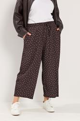 YOURS Plus Size Chocolate Brown Polka Dot Barrel Trousers | Yours Clothing 1