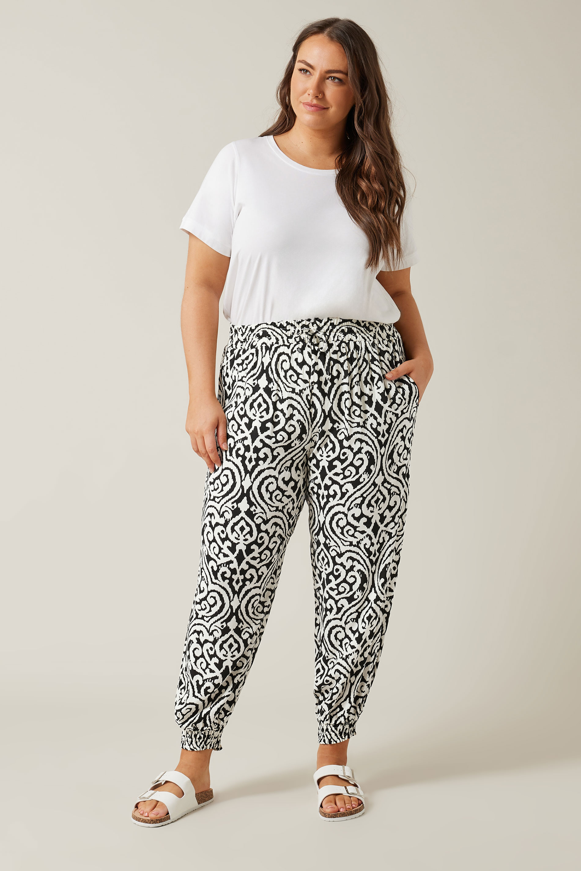 EVANS Plus Size Black Ikat Print Cuffed Harem Trousers | Evans  1