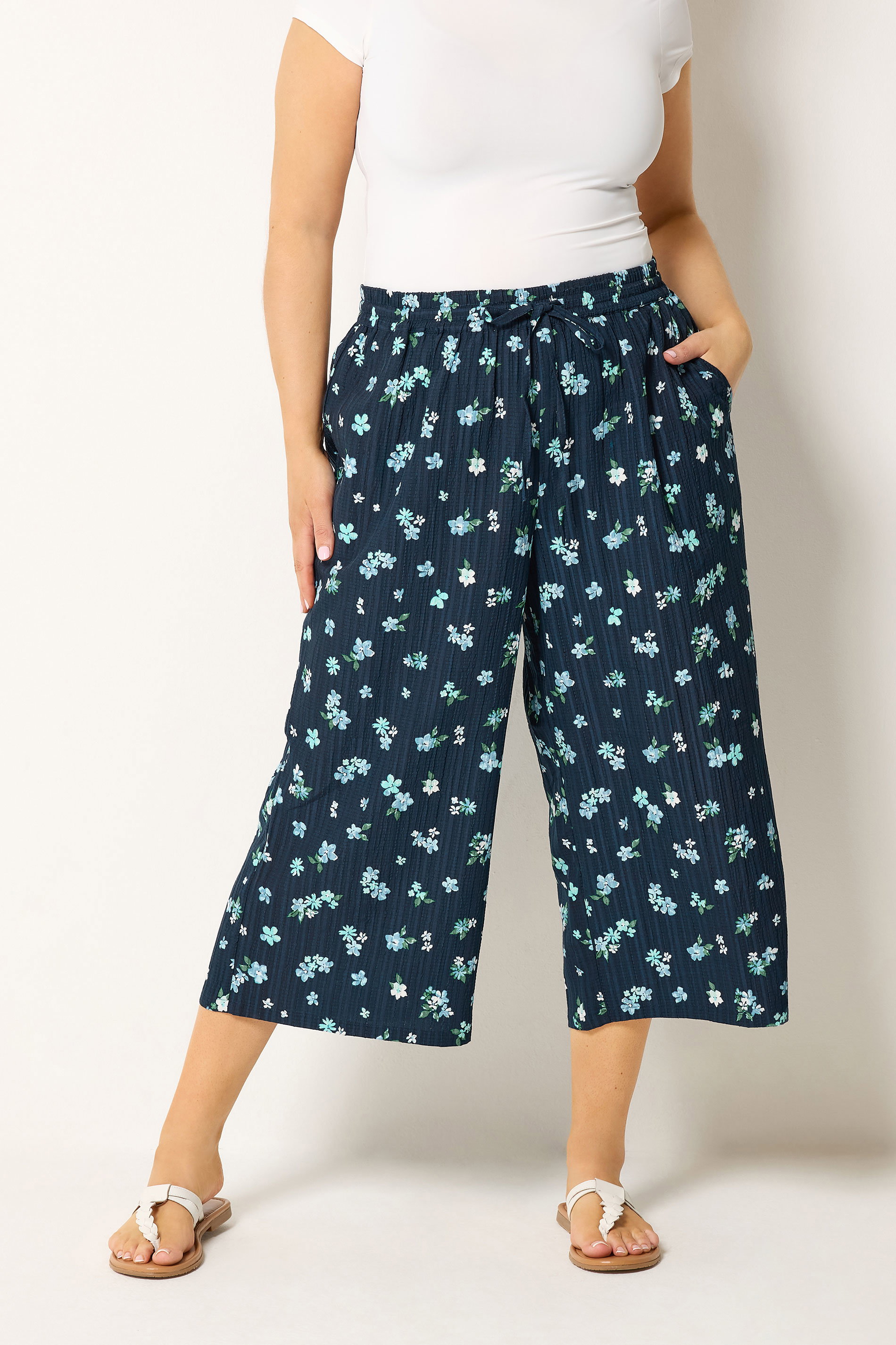 YOURS Plus Size Navy Blue Floral Crop Trousers | Yours Clothing 1
