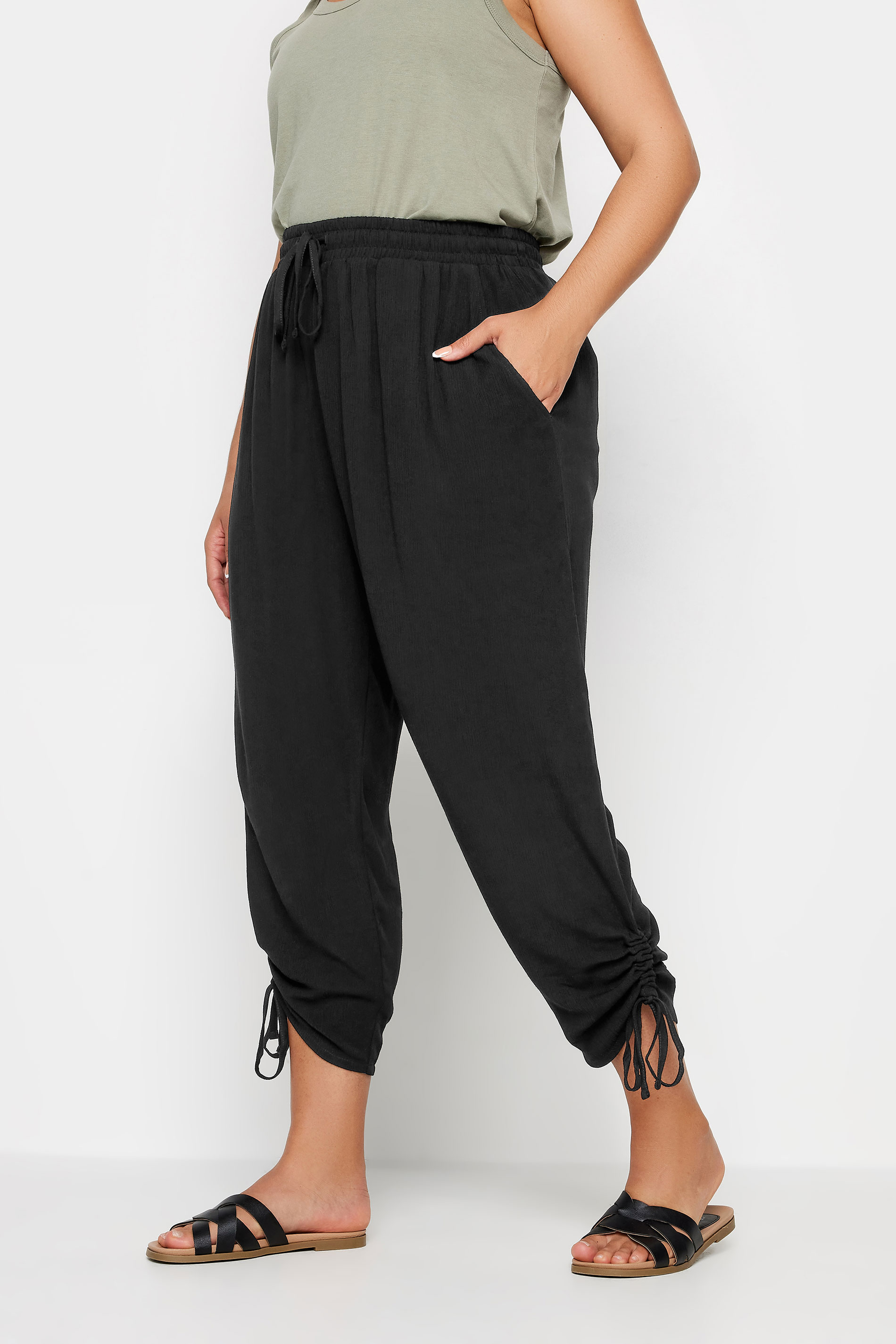 YOURS Plus Size Black Crinkle Ruched Cropped Trousers | Yours Clothing 1