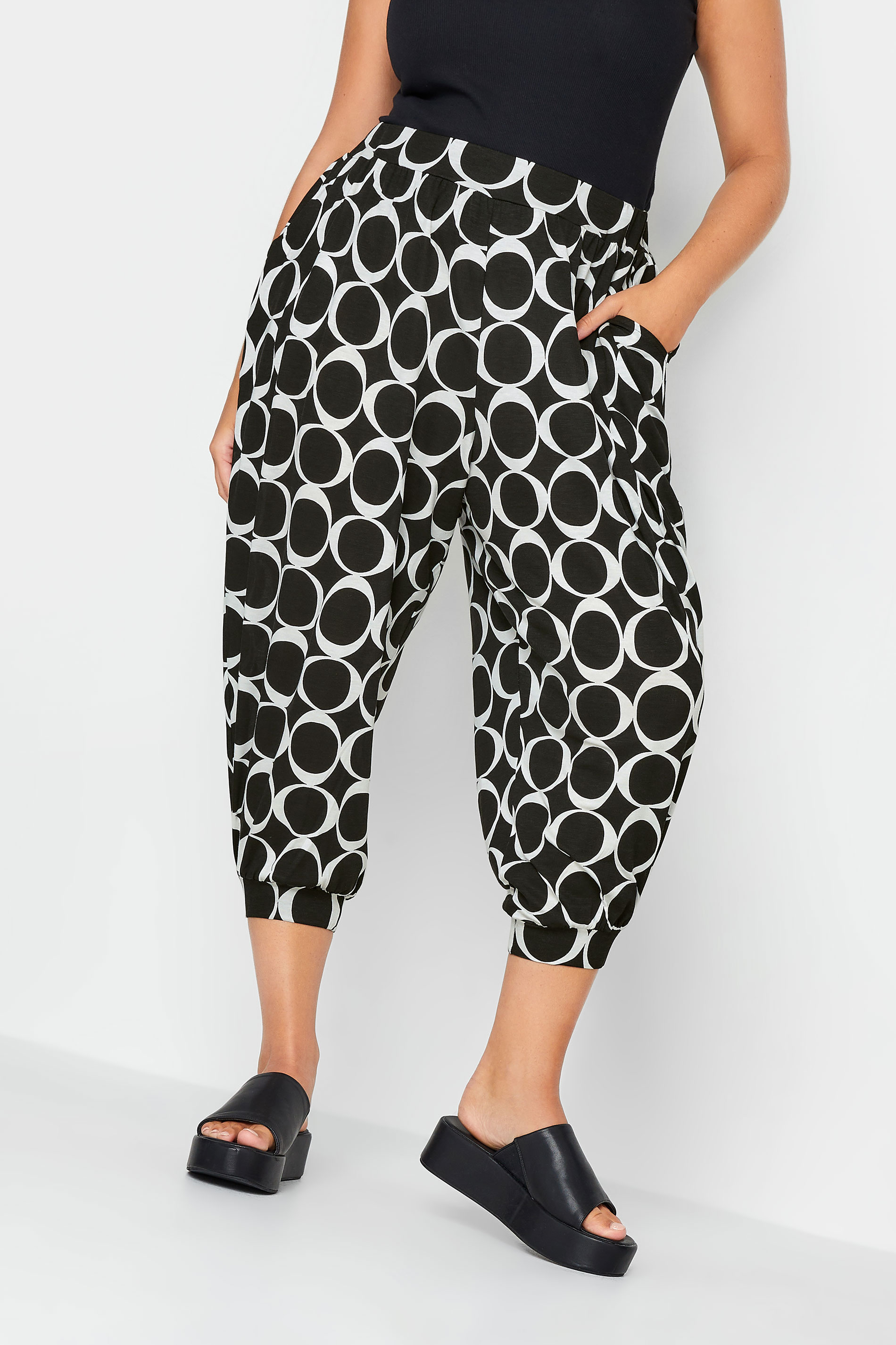 YOURS Plus Size Black Geometric Print Cropped Harem Trousers | Yours Clothing 1